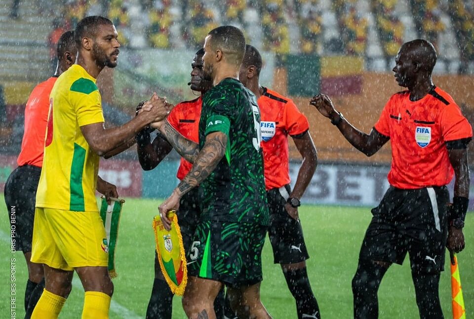 Steve Mounie (left) exchanging pre-match pleasantries with Super Eagles captain William Troost-Ekong