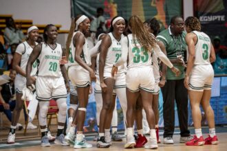 D'Tigress celebrate quarterfinal win over Cameroon