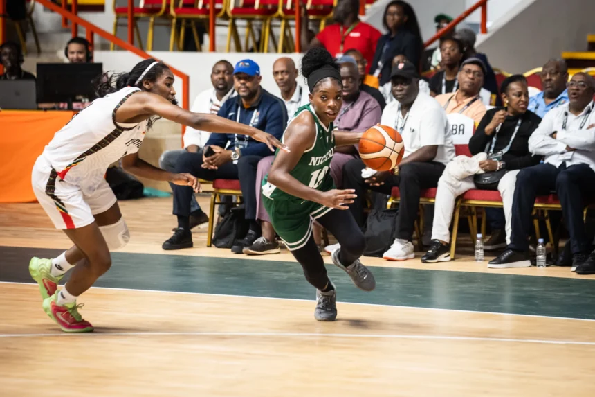 D'Tigress' Promise Amukamara (right)