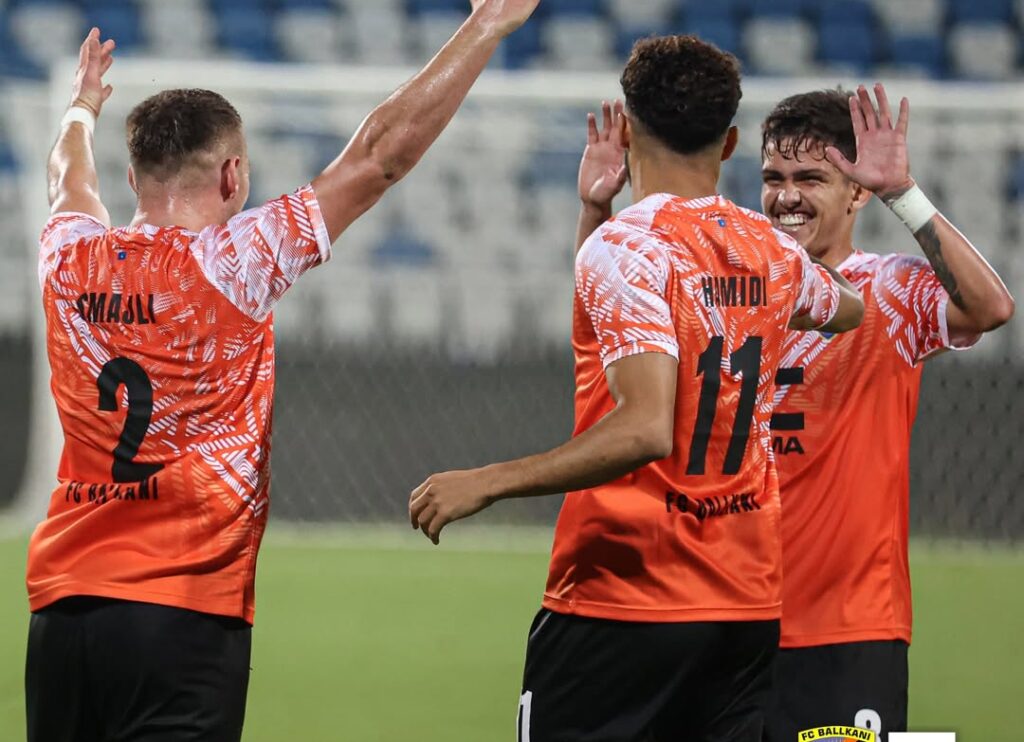 Sunday Adetunji's teammates celebrate a goal
