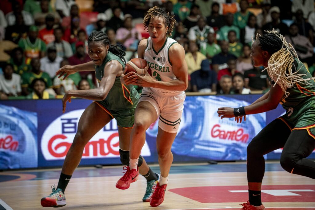 D'Tigress' Pellas Kunaiyi-Akpanah (middle) in action against Cameroon