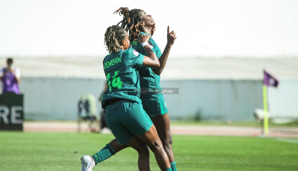Oluwatosin Demehin celebrates with teammates