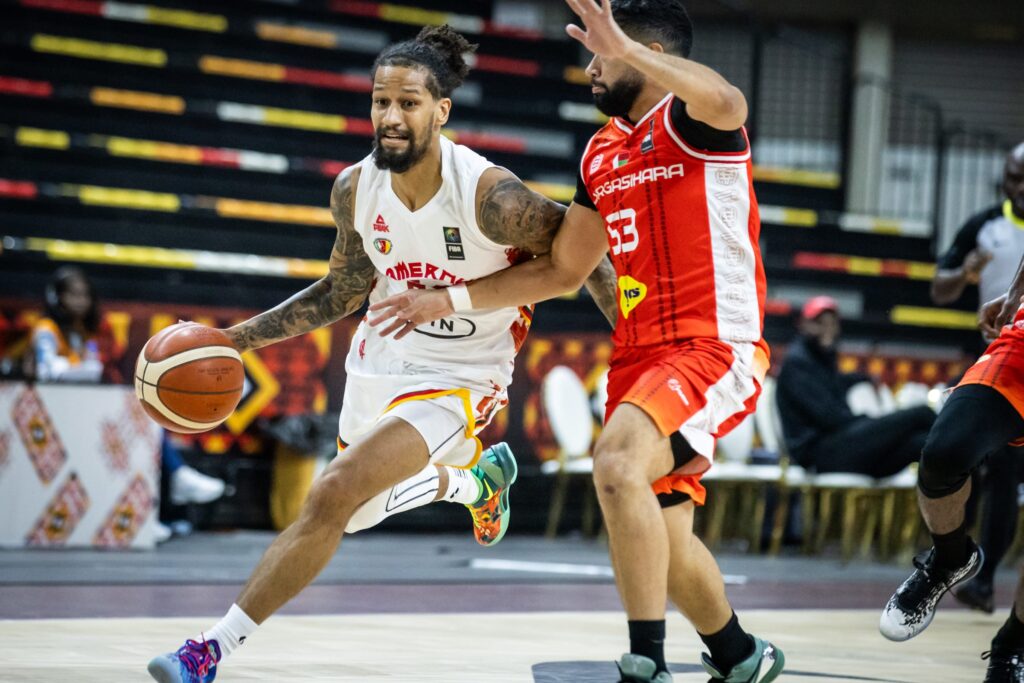 Cameroon's Jeremiah Hill (left) in action against Madagascar at Afrobasket 2025