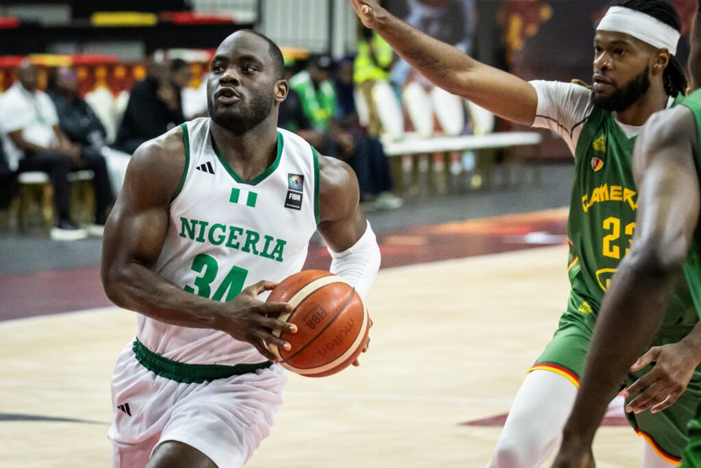 Ike Nwamu (left) in action for D'Tigers