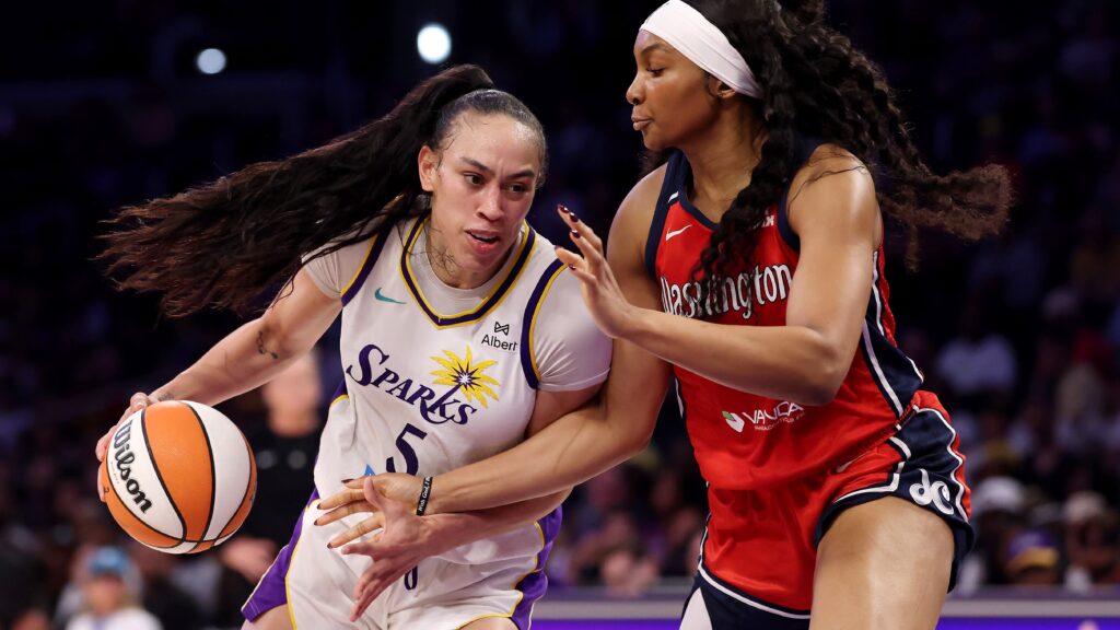 Kiki Iriafen (right) in action against the Los Angeles Sparks