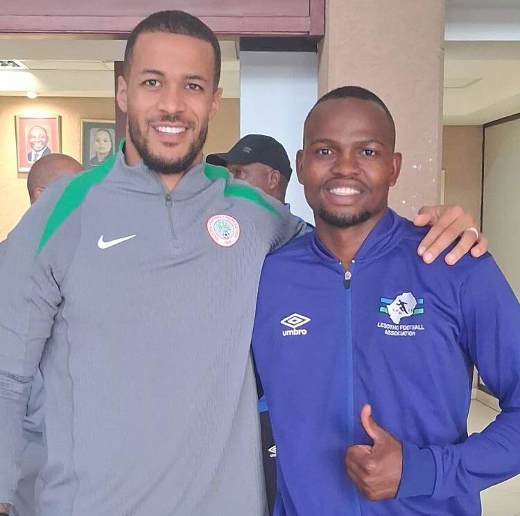 Lesotho captain Sekhoane Moerane (right) with Super Eagles skipper William Troost-Ekong