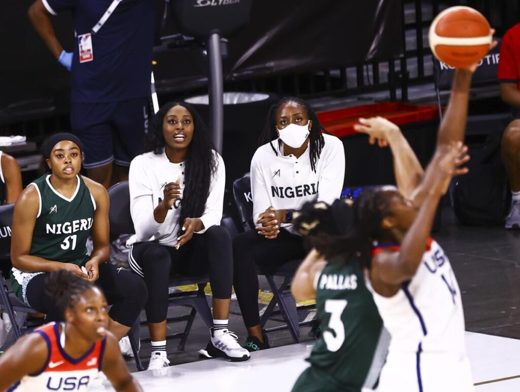 Nneka Ogwumike (far right) and sister Chiney (middle) watching D'Tigress play against the USA