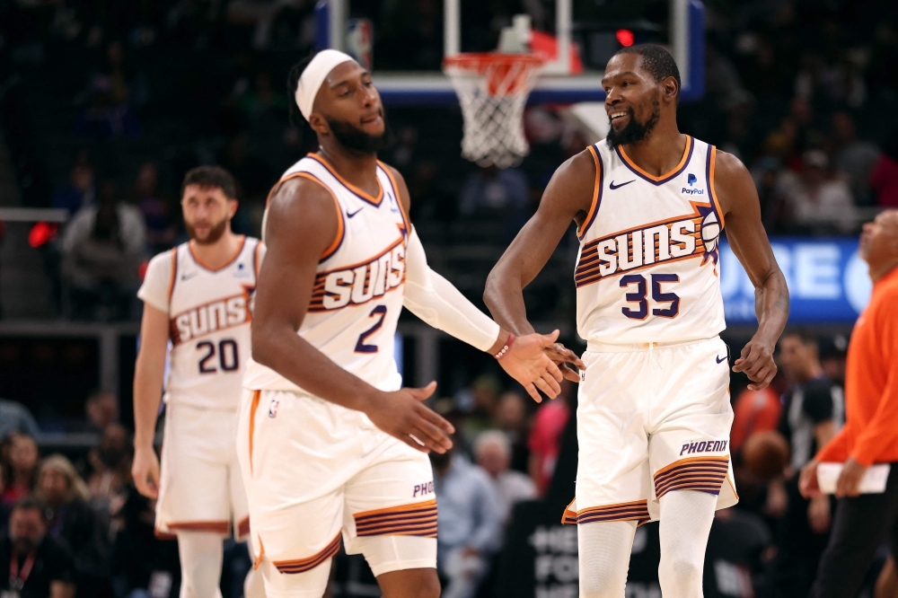 Josh Okogie (left) and Kevin Durant with the Phoenix Suns