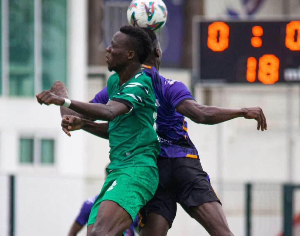 Rivers United and Black Bulls player vying for the ball