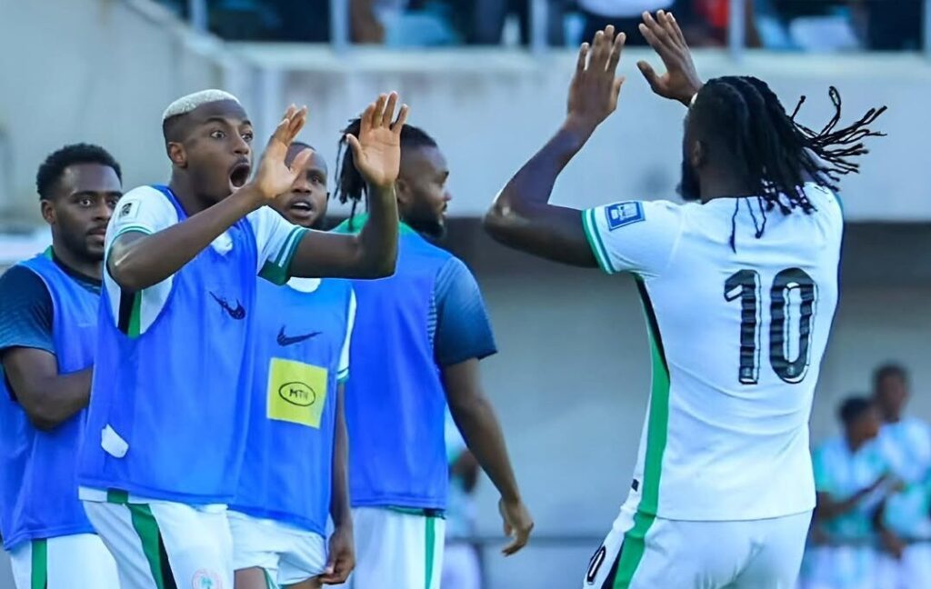 Arokodare (No. 10) celebrates a goal with Osimhen