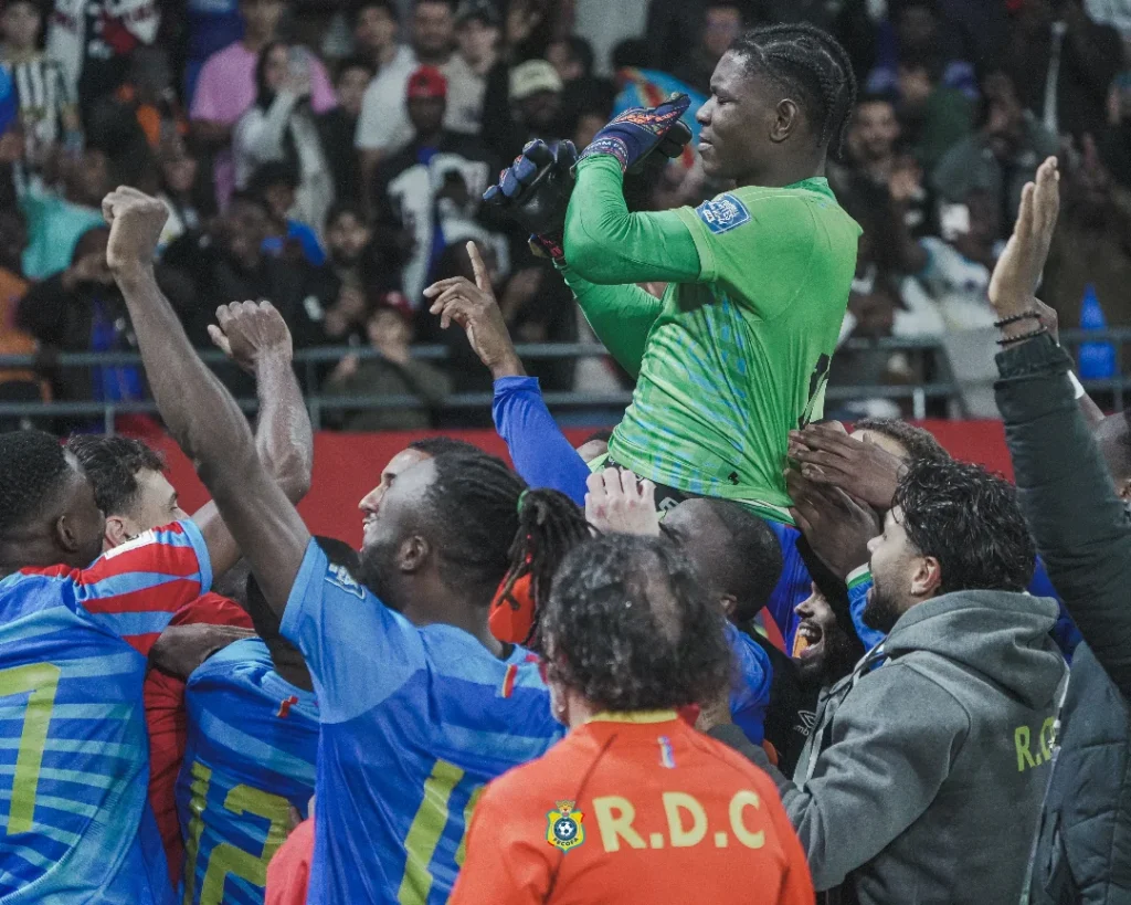 DR Congo players celebrate with their hero, goalkeeper Timothy Fayulu