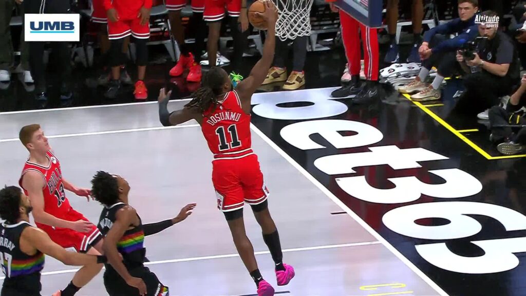 Ayo Dosunmu attempts a dunk against the Denver Nuggets