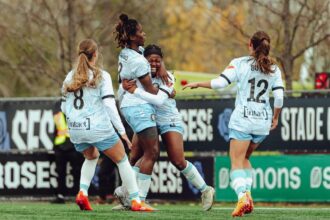 Esther Okoronkwo celebrates a goal with teammates