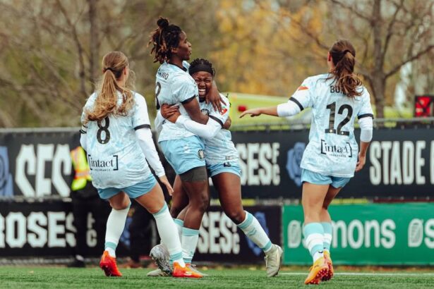 Esther Okoronkwo celebrates a goal with teammates