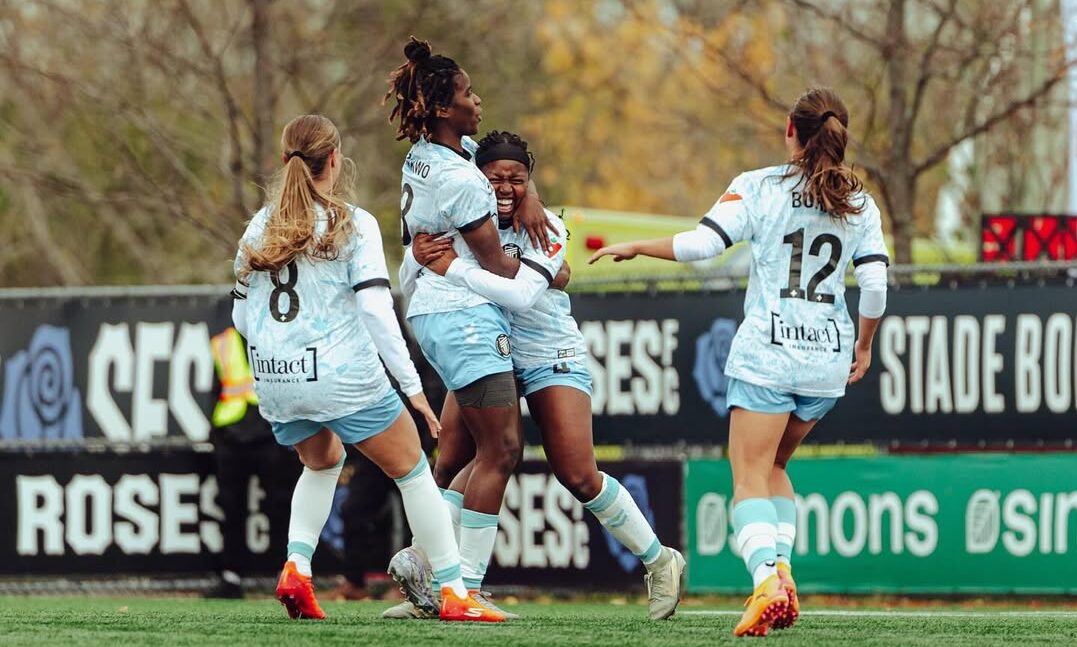 Esther Okoronkwo celebrates a goal with teammates