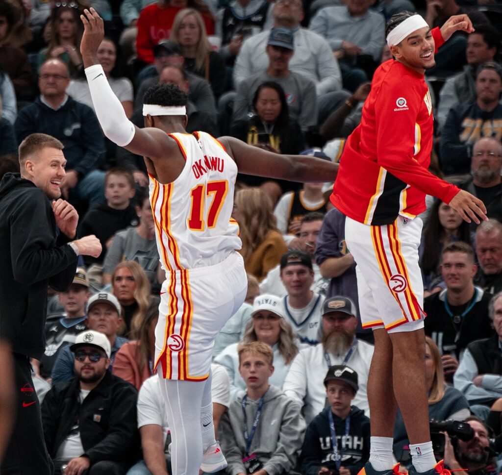 Onyeka Okongwu (left) celebrates with teammate