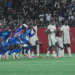 Calvin Bassey looks on as DR Congo celebrate their victory over the Super Eagles