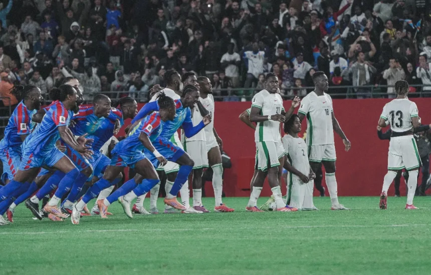 Calvin Bassey looks on as DR Congo celebrate their victory over the Super Eagles