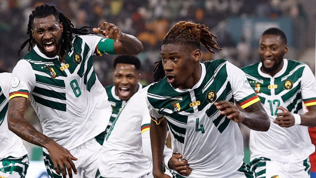Cameroon players celebrate scoring a goal