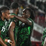 Super Eagles players celebrate a goal