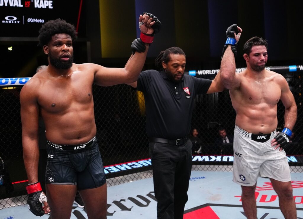 Kennedy Nzechukwu (left) and Marcus Almeida raised signifying a draw