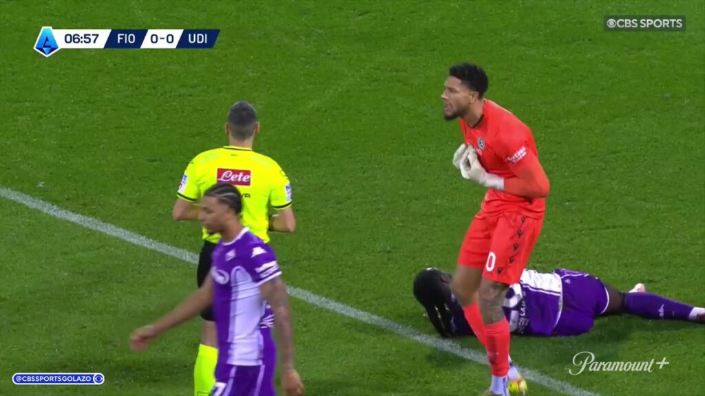 Maduka Okoye pleading his innocence to referee Maurizio Mariani