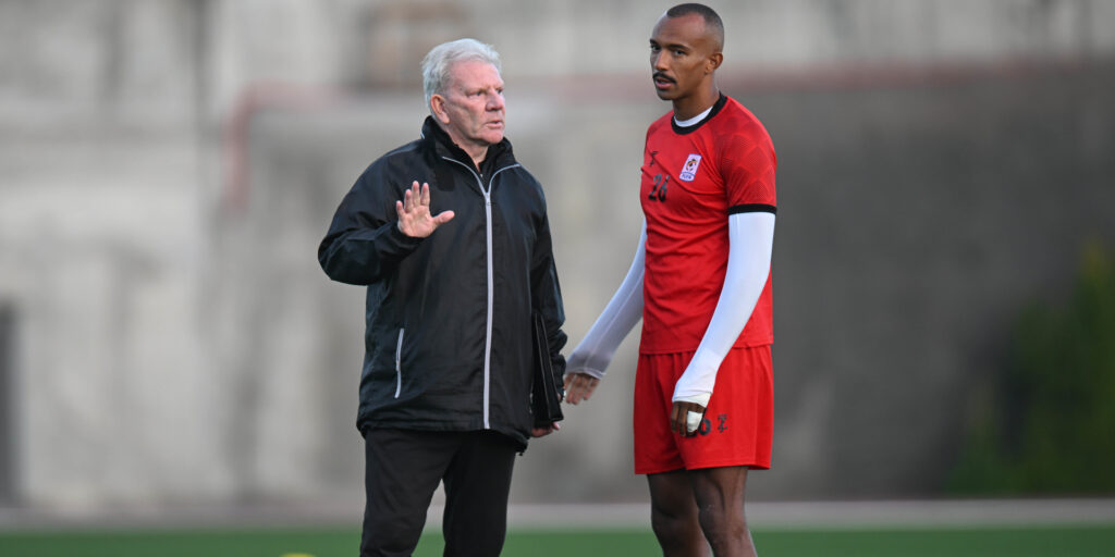 Uganda coach Paul Put (left)