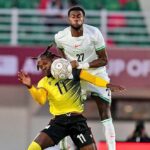 Ryan Alebiosu (up) in action against Uganda