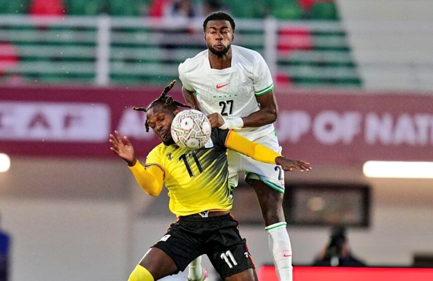 Ryan Alebiosu (up) in action against Uganda