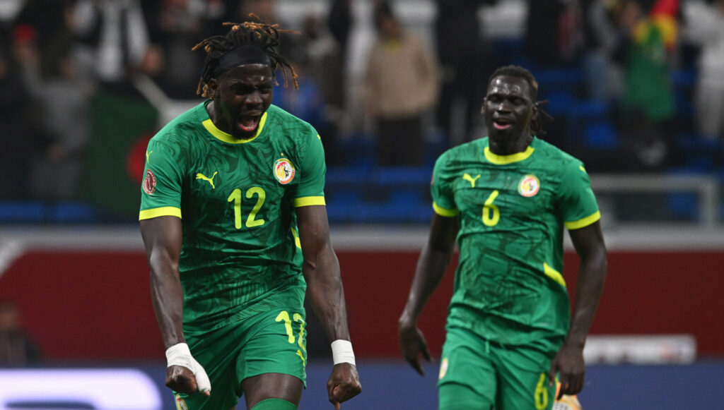Senegal players celebrate their goal against Benin