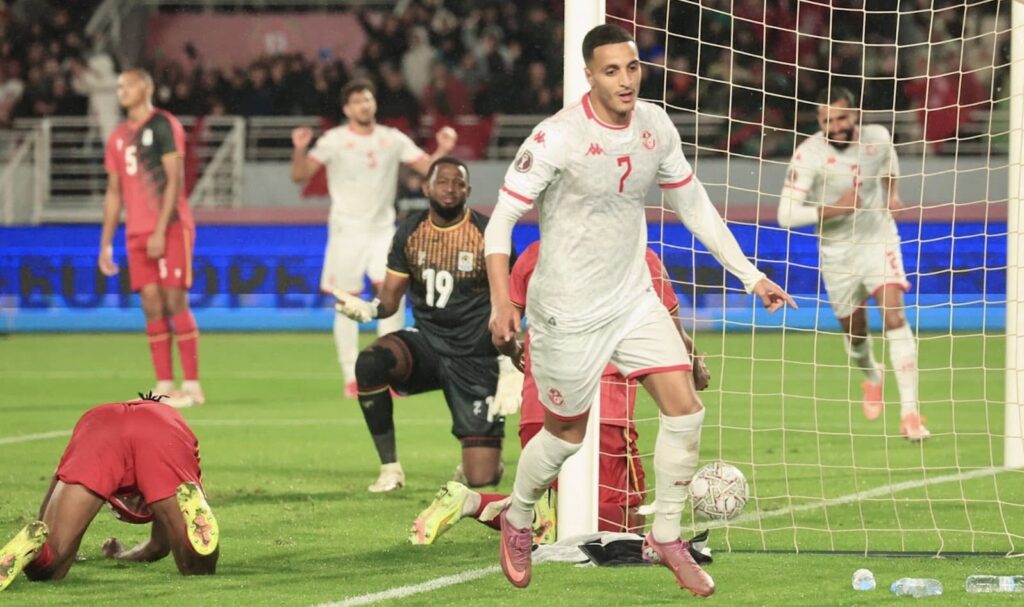 Elias Achouri celebrates his goal against Uganda