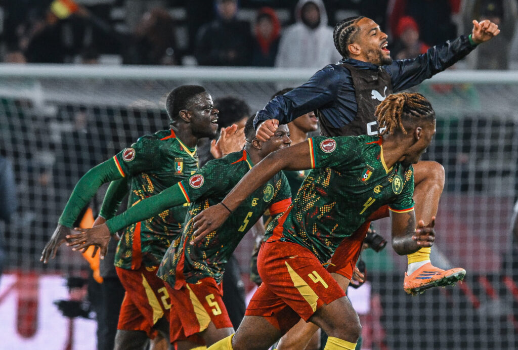 Cameroon players celebrate advancing to AFCON quarter-finals