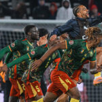 Cameroon players celebrate advancing to AFCON quarter-finals