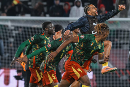 Cameroon players celebrate advancing to AFCON quarter-finals
