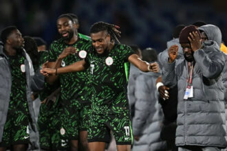 Alex Iwobi celebrating with teammates