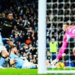 Alex Iwobi in action against Manchester City