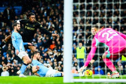 Alex Iwobi in action against Manchester City