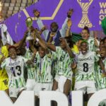 Super Falcons lifting WAFCON 2024 trophy in Morocco