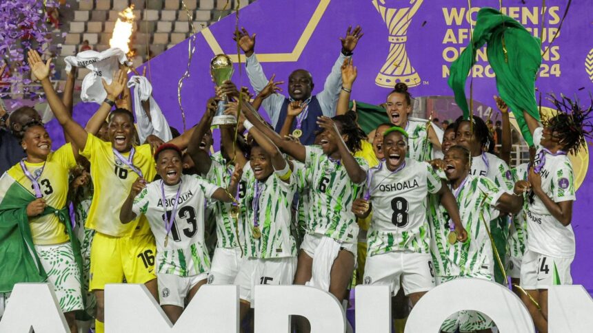 Super Falcons lifting WAFCON 2024 trophy in Morocco
