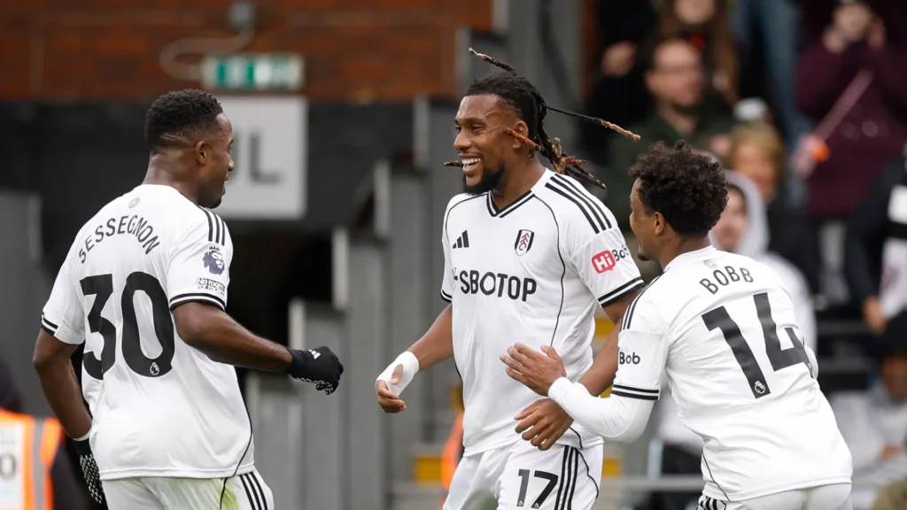 Alex Iwobi celebrates his goal with teammates