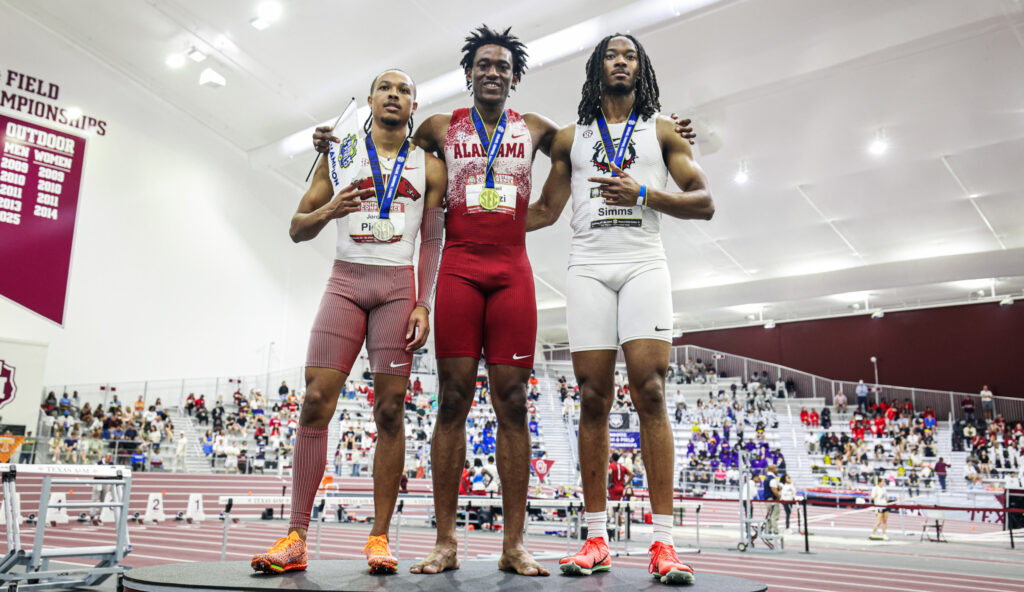 Samuel Ogazi (middle) on the podium after his historic win