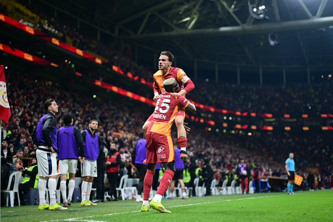 Osimhen celebrates with teammate 
