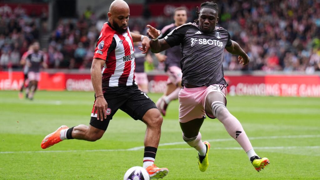 Calvin Bassey (left) defending against Bryan Mbeumo