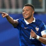 Kylian Mbappé scores twice as France secure World Cup knockout place with 3-0 victory over Iraq