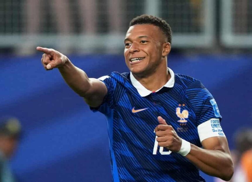 Kylian Mbappé scores twice as France secure World Cup knockout place with 3-0 victory over Iraq