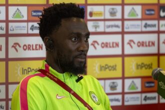 ‎Wilfred Ndidi reacts after Nigeria's late 2-2 draw against Poland