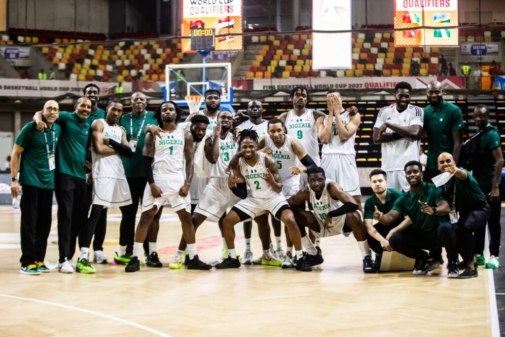 D'Tigers celebrate their victory over Guinea