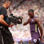 Kanyinsola Ajayi celebrates winning the 100m sprint at the London Diamond League