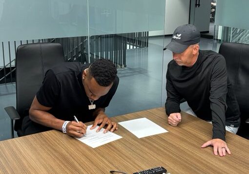 Ugonna Onyenso signing the dotted lines