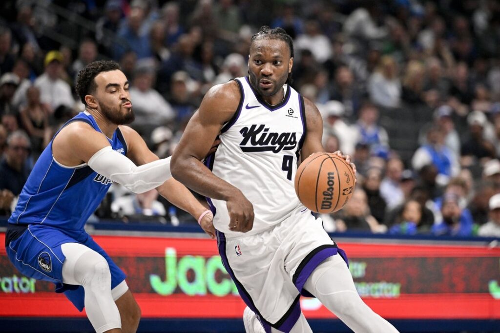 Precious Achiuwa (front) in action for the Sacramento Kings